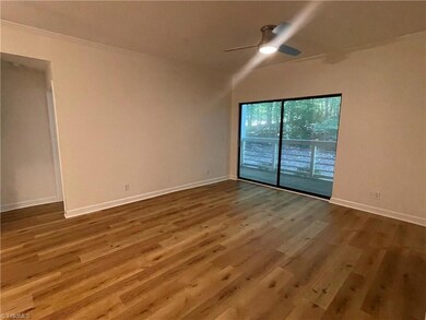 Living room with sliding door to covered deck