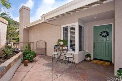 Gated courtyard entry with stamped concrete