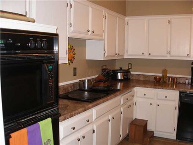 New counter top, tile in kitchen, with a window to