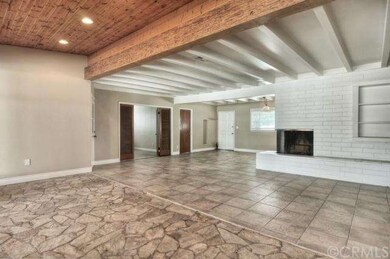 Open floor plan - living room with wood and beamed