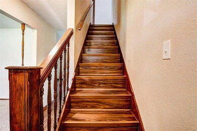 Beautiful stairs.  2 Baths upstairs and 1/2 Bath d