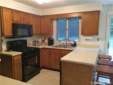 Kitchen. Eat-in Kitchen with oak cabinetry and neu