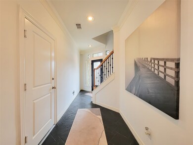 This photo showcases a bright, inviting entryway w