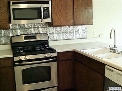 Gourmet kitchen overlooks family room and beautifu