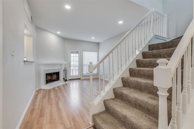 Stairway with hardwood / wood-style flooring