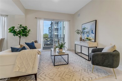 Open-concept floor plan with a roomy living area and sliding doors that lead seamlessly to the balcony.