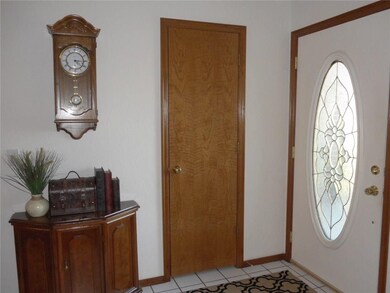Inside entry, ceramic tile flooring, coat closet