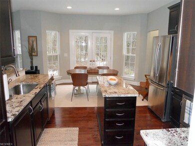 gourmet kitchen featuring granite counter tops, st
