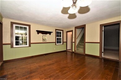 Nicely sized living room with gorgeous wood floors