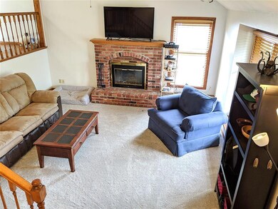 Large Living room with fireplace.  TONS of natural