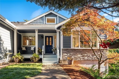 A covered entry and porch greet your guests and keeps them out of the rain. Stone accents add a nice architectural detail to this lovely home.