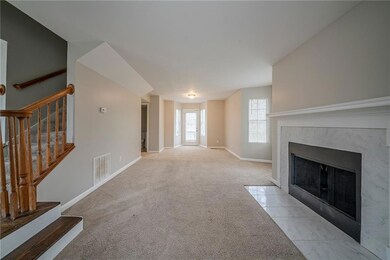 Unfurnished living room featuring light colored ca