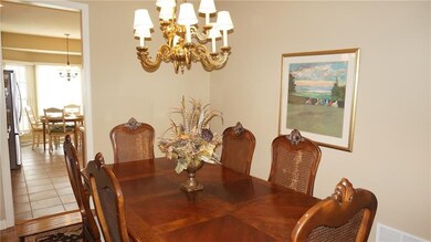 Dining Room - Hardwood flooring, chandelier, open 