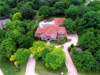Gorgeous one owner custom home on wooded acreage