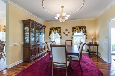 The formal Dining Room is to the right of the foyer and opens to the kitchen.