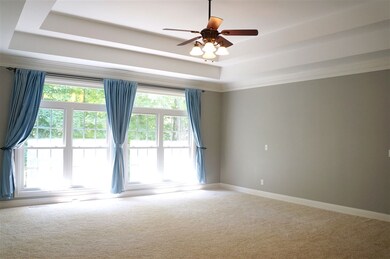 Huge master bedroom with a dramatic double tray ce