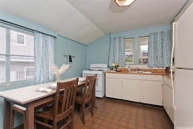 Kitchen with gas stove and space for breakfast tab
