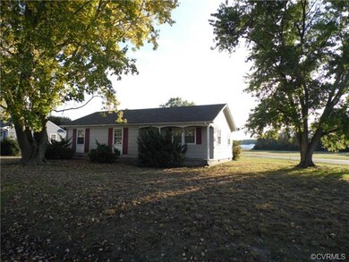 Additional view showing front porch, corner lot.