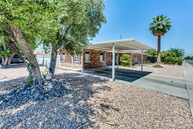Exterior Front of home with 2-car carport, desert