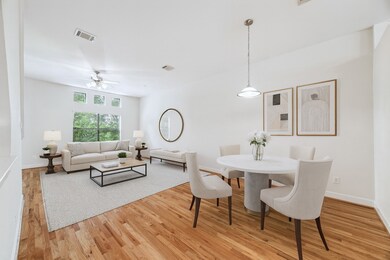 Virtually staged living and dining areas to illustrate the full potential of this versatile space.