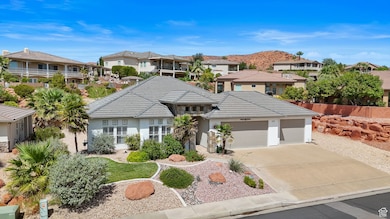View of front of home featuring a residential view, a garage, concrete driveway, and stucco siding