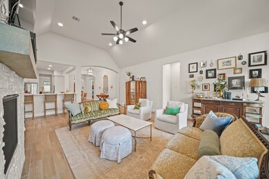 Open-concept Family Room is spacious & inviting, p