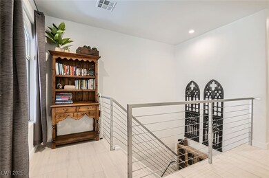 Hallway featuring an upstairs landing and recessed