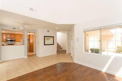 Kitchen view from living room. Stairs to second fl