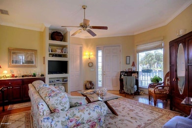 Living room opens to kitchen and balcony