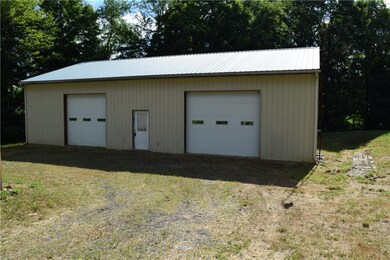 This huge outbuilding would fit multiple cars or A