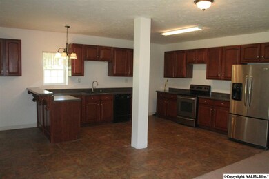 Open floor plan with kitchen, Laminate floors .  Breakfast bar.