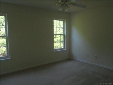 Spacious Master Suite with Ceiling Fan, Neutral De