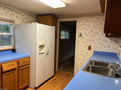 kitchen also provides entry to family room