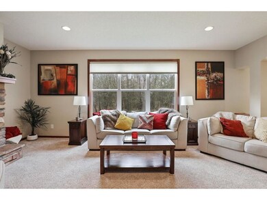 Large windows open to private wooded backyard