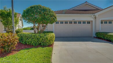 View of front of home featuring a tiled roof, an a
