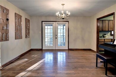 The Dining Room has hardwoods and access to the sc
