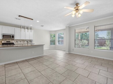 This is a bright, open-concept kitchen with white