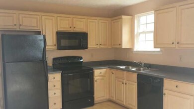 Kitchen has a walk out deck and all appliances remain.