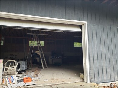 Garage door with concrete pad. Concrete floor inte