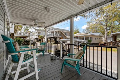 Wooden deck with a ceiling fan and a residential v