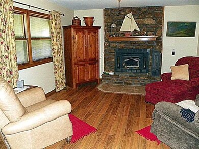 Living Room. This Robust Wood burner with insert will keep you warm on chilly nights. NO POPCORN ceilings!!
