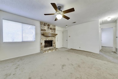 Unfurnished living room featuring a fireplace, a 