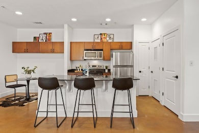 Kitchen featuring stainless steel appliances, fin