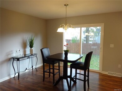 Bright and cheerful dining area with sliding glass