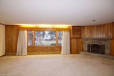Large living space with loads of windows.