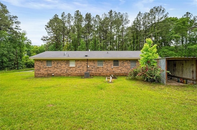 Rear view of property featuring brick siding and a
