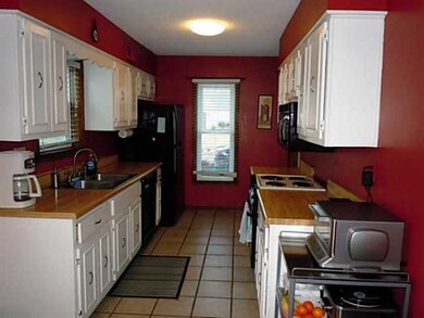 Spacious kitchen with lots of natural light.  Beau