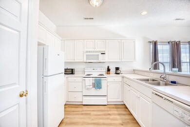 Kitchen with sink, light hardwood / wood-style flo