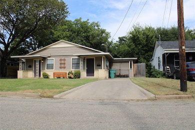 Bungalow-style home with brick siding and covered porch