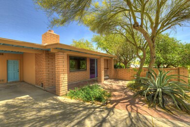 Wise water use creates shaded entrance.